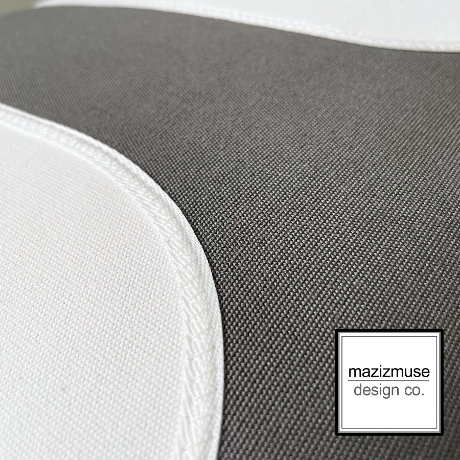 grey and white sunbrella outdoor pillow showing trim and stitch detail with mazizmuse logo