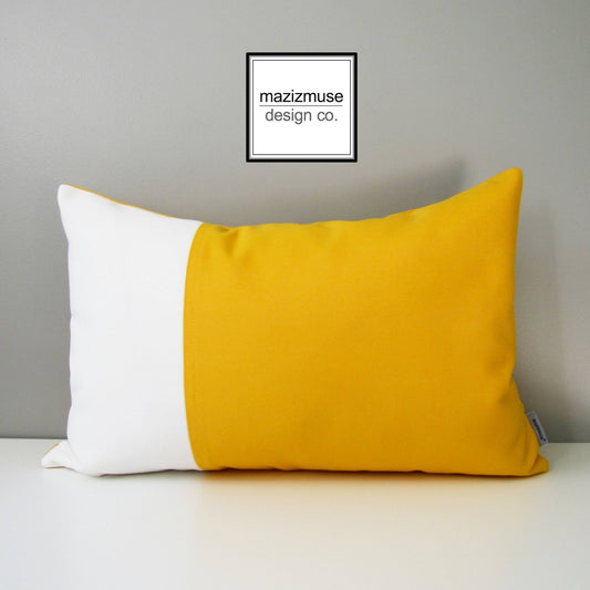 sunflower yellow and white outdoor pillow in a colorblock design
