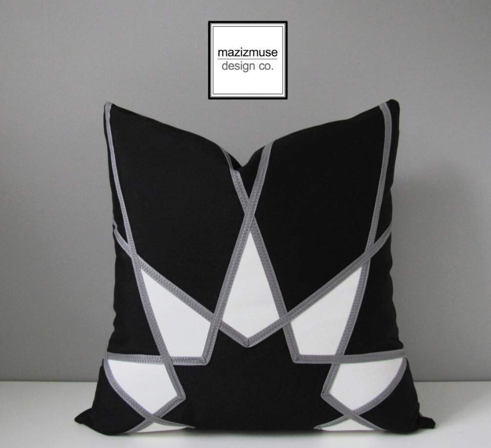 black white sunbrella outdoor pillow with art deco starburst design and grey trim detail
