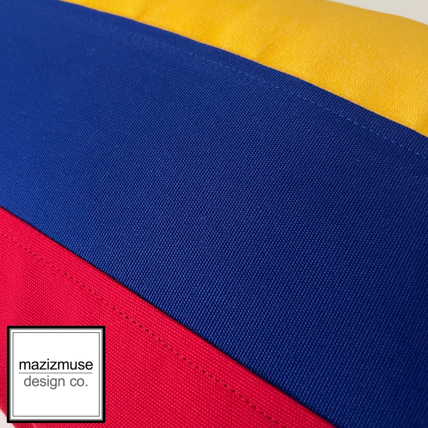 close up photo of colombian flag colors and logo by mazizmuse
