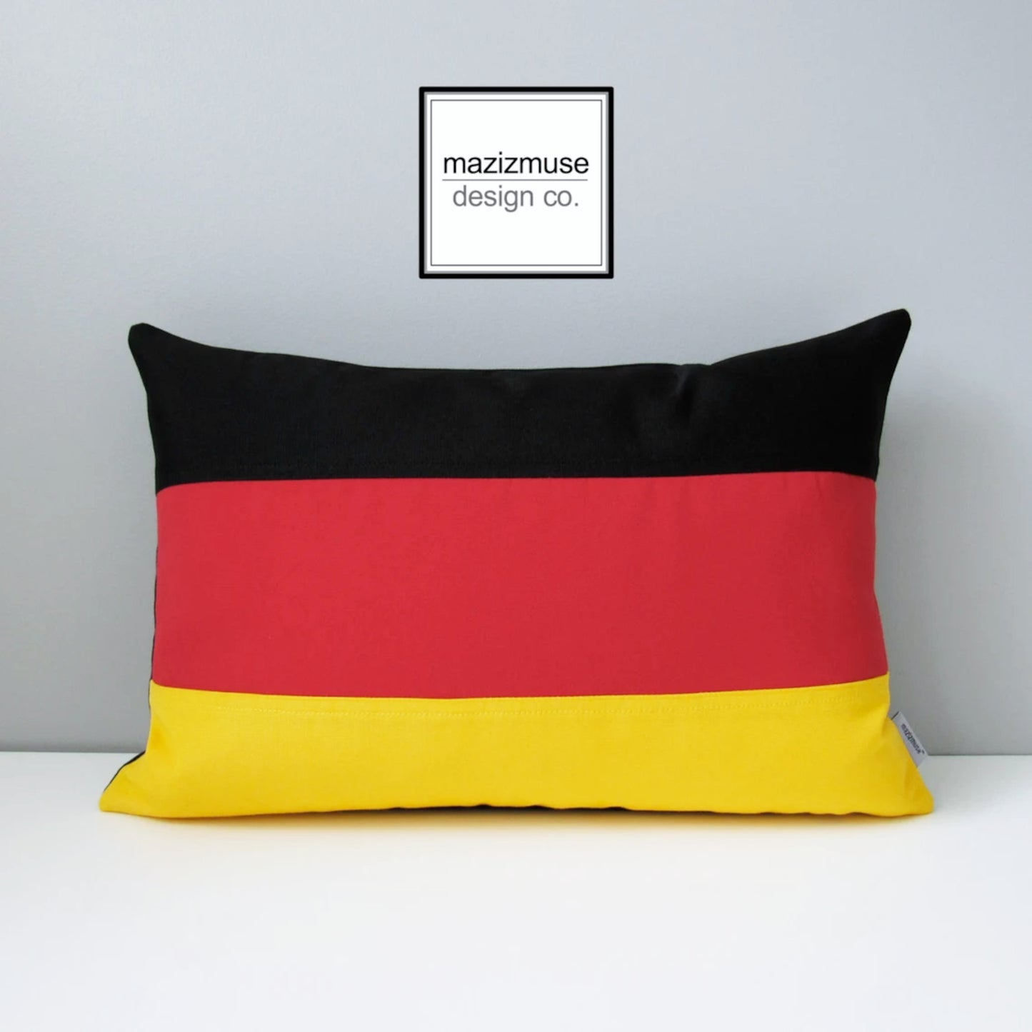 decorative german flag pillow with red yellow black sunbrella fabric.