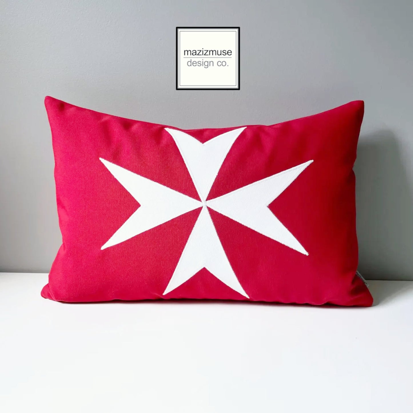 red and white maltese flag with ensign crest. crafted with sunbrella indoor outdoor fabric for fade and stain resistance.