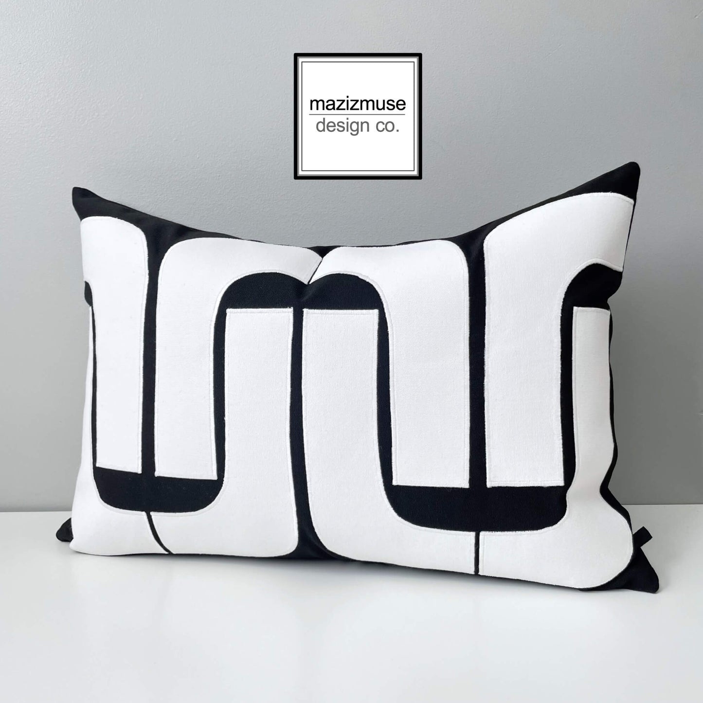 striking black and white outdoor pillow in bold mod design inspired by mid century style. Handmade in Canada by mazizmuse