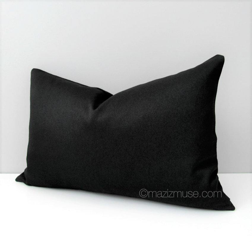 solid black outdoor sunbrella pillow in lumbar size