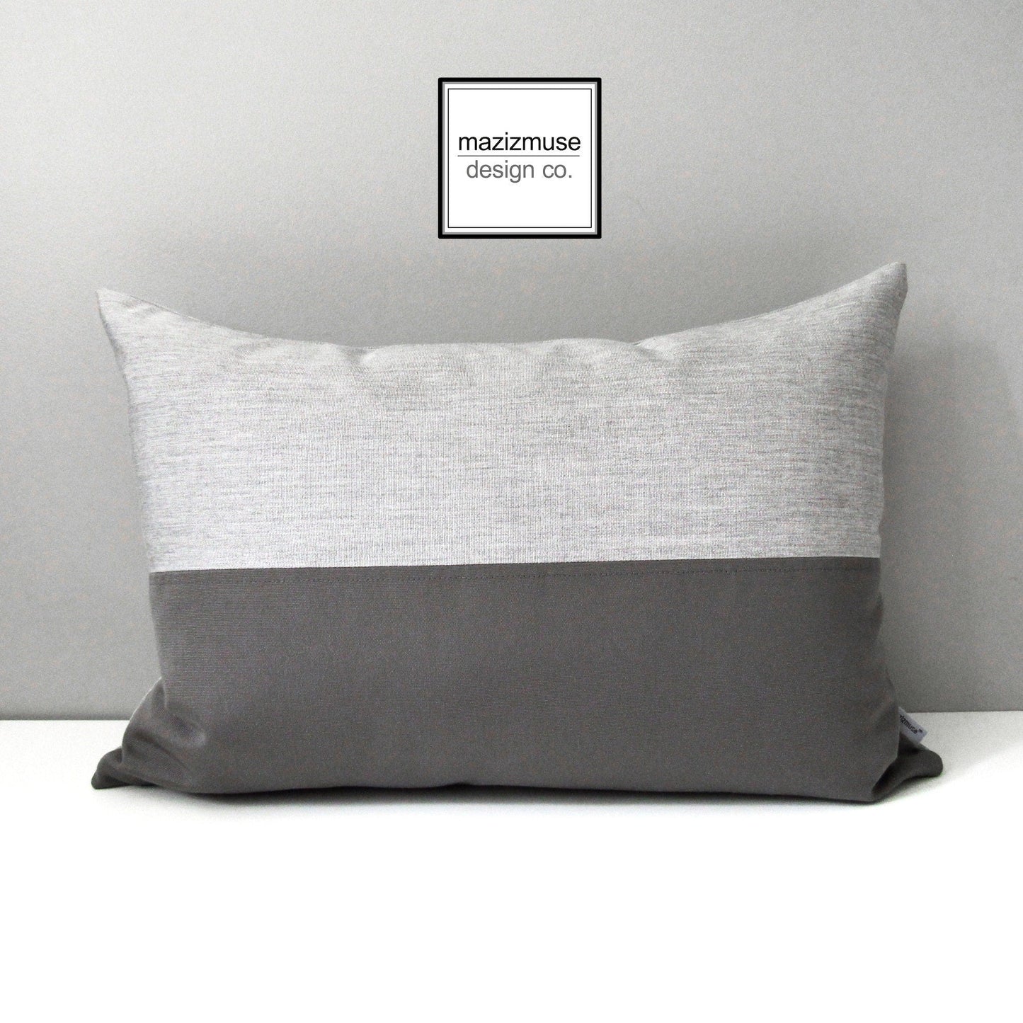 light and dark grey sunbrella outdoor pillow for modern patio seating