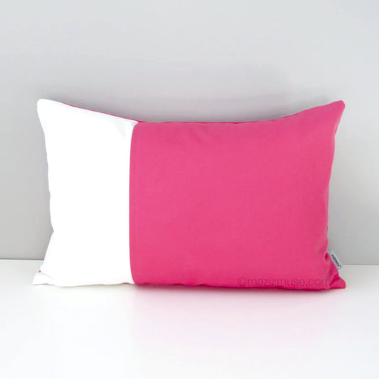 hot pink and white colorblock outdoor pillow in sunbrella fabric for pool, patio and porch seating and home decor