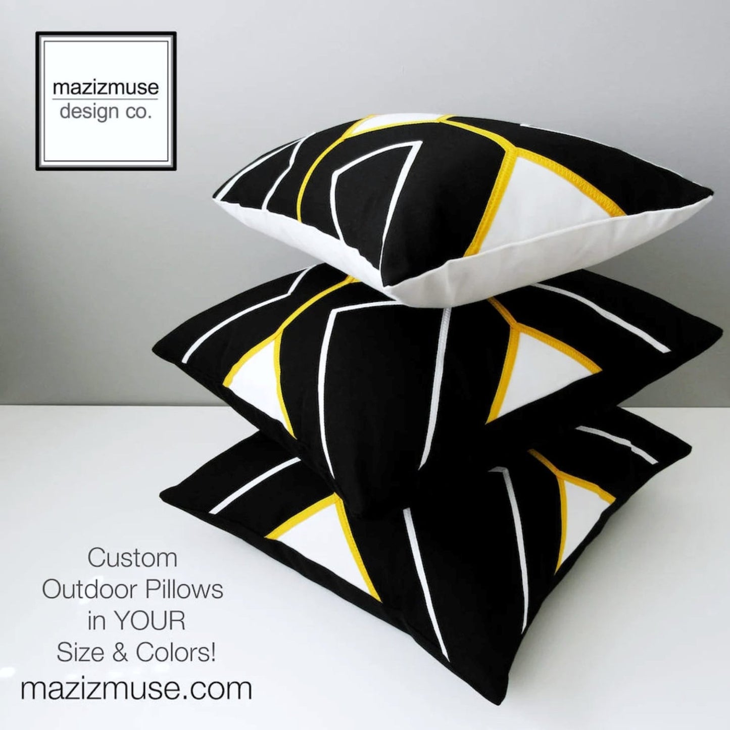 stack of black white and yellow pillows crafted in sunbrella outdoor fabric for lasting appeal. handmade in canada by mazizmuse