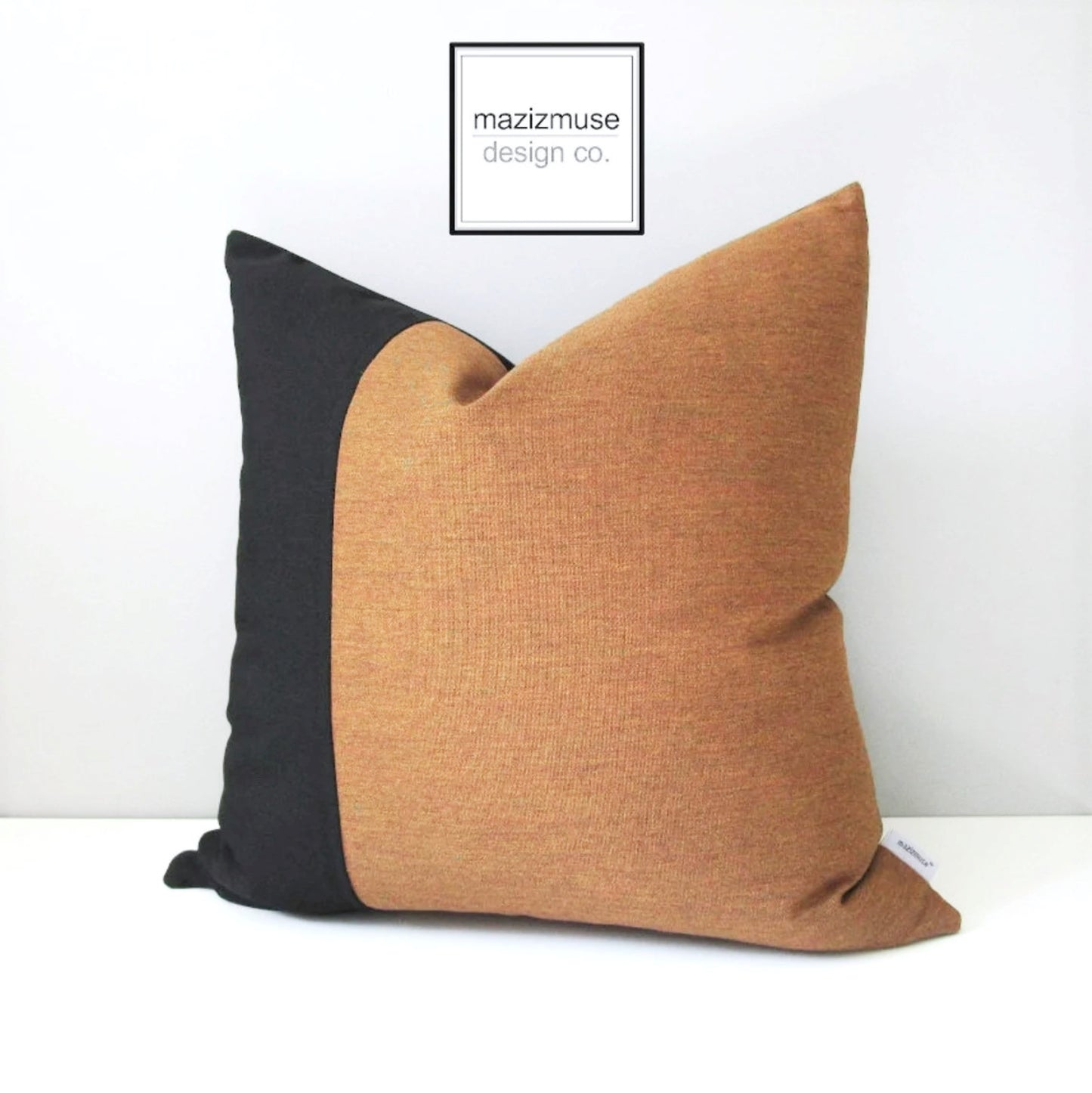 modern teak sunbrella outdoor pillow with black colorblock