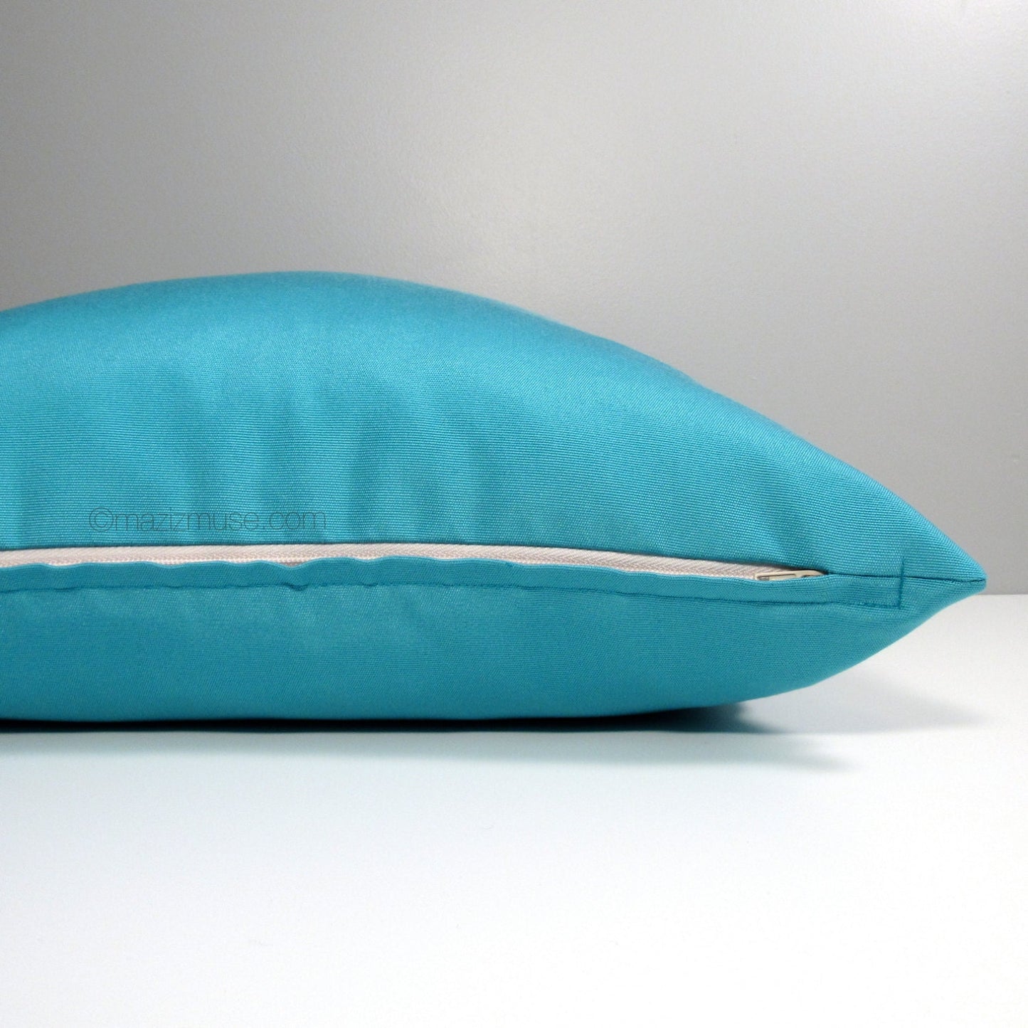 solid turquoise blue sunbrella outdoor pillow cushion with zip