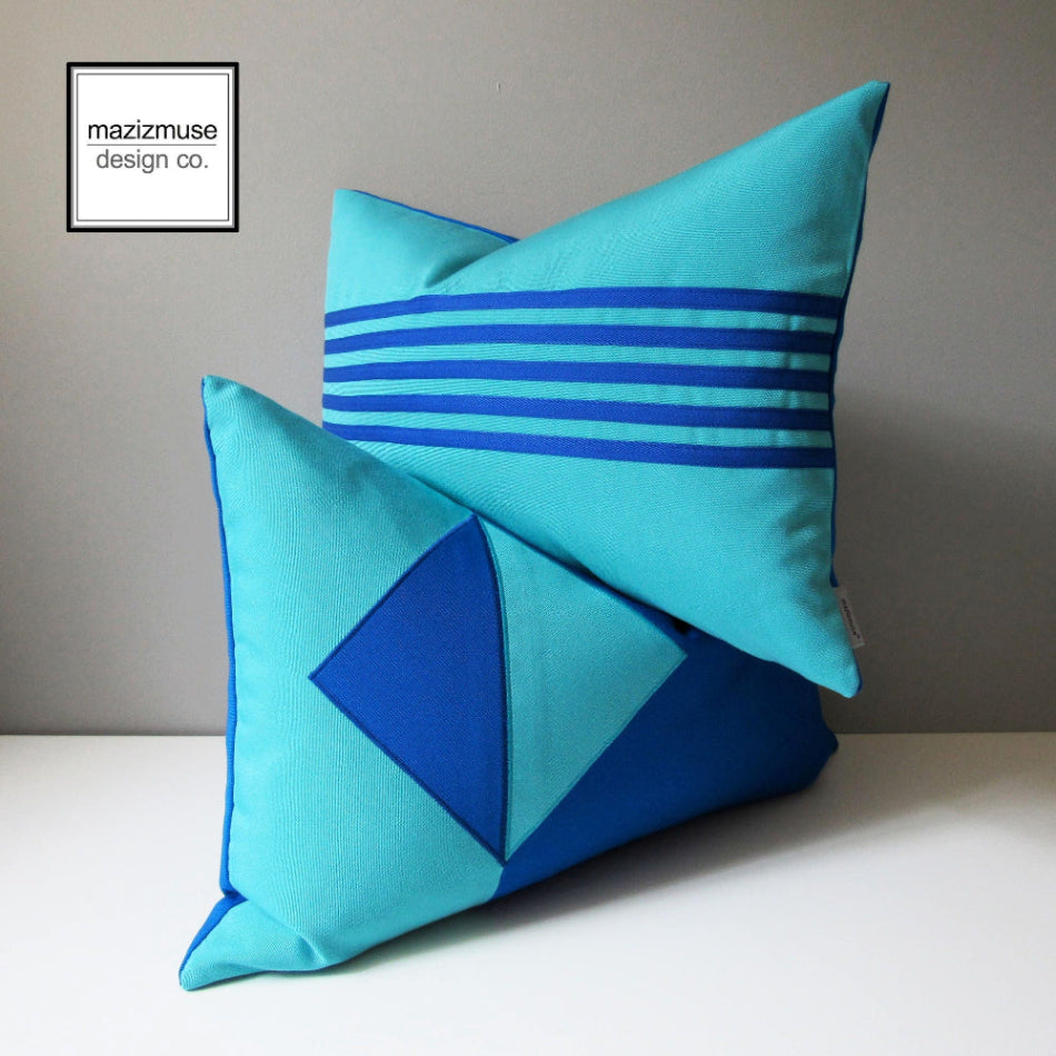 pair of modern outdoor pillows in pacific and aruba blue sunbrella fabric for outdoor seating, decorative blue geoemetric cushions in lumbar sizes