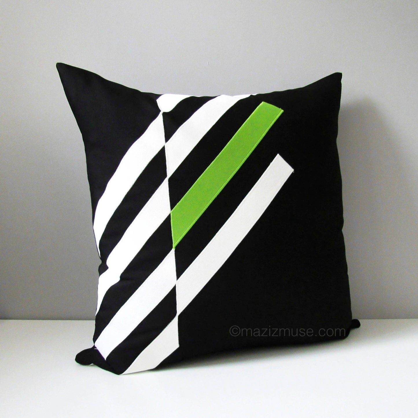 black and lime green outdoor pillow in sunbrella fabric for fade and stain resistance.