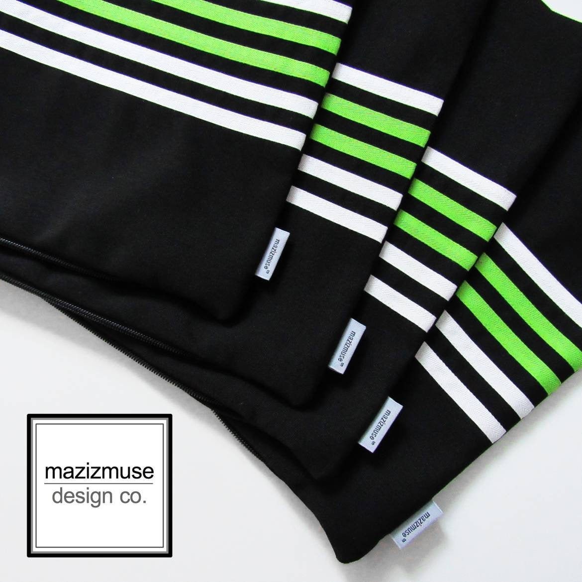 black outdoor sunbrella pillow with white sand lime green stripes