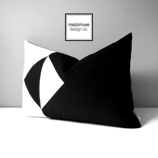 black and white Sunbrella outdoor pillow with large white and black opposing triangles