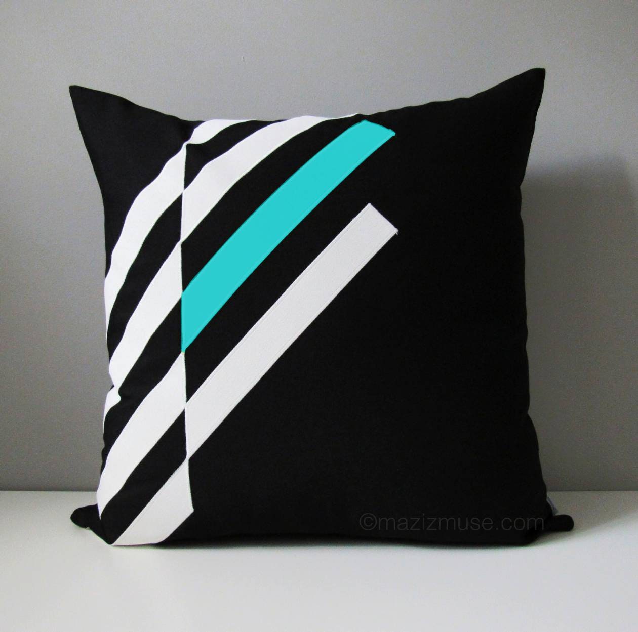 modern black white and aruba blue sunbrella pillow for outdoor patio