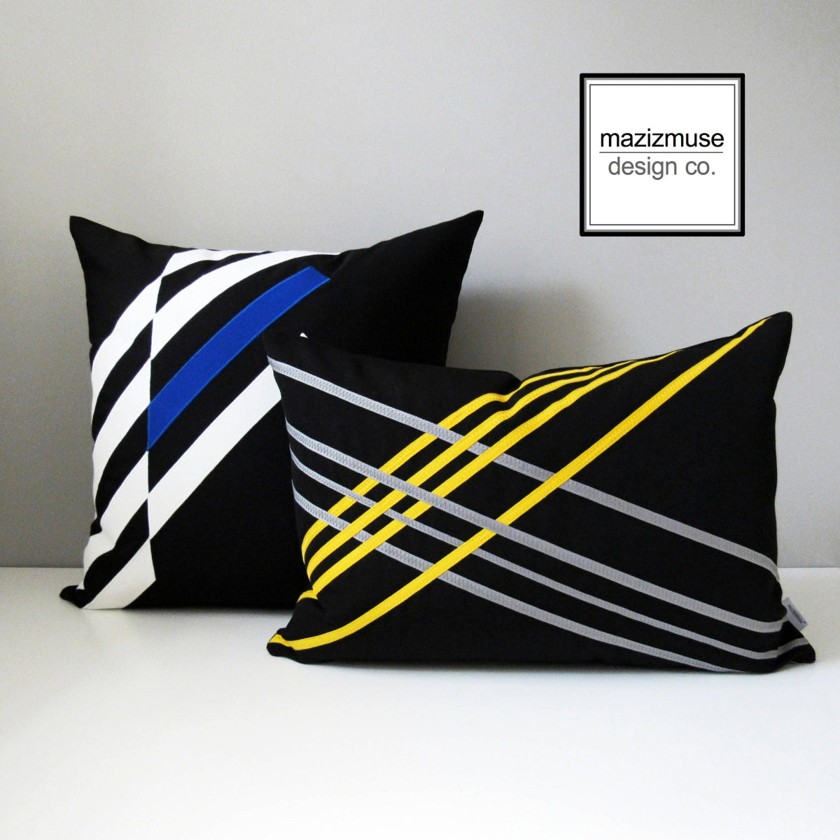 black and white sunbrella outdoor pillows with colorful accents for patio and garden seating
