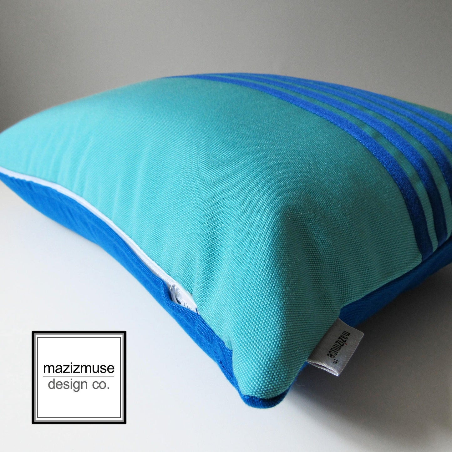 pacific and aruba blue sunbrella outdoo rpillow detail shot of trim stitch and zipper