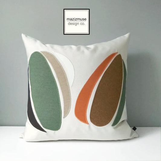 abstract sunbrella outdoor pillow with green brown rust design on creamy background by mazizmuse
