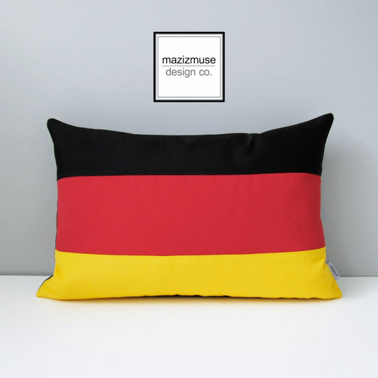 decorative german flag pillow with red yellow black sunbrella fabric. 