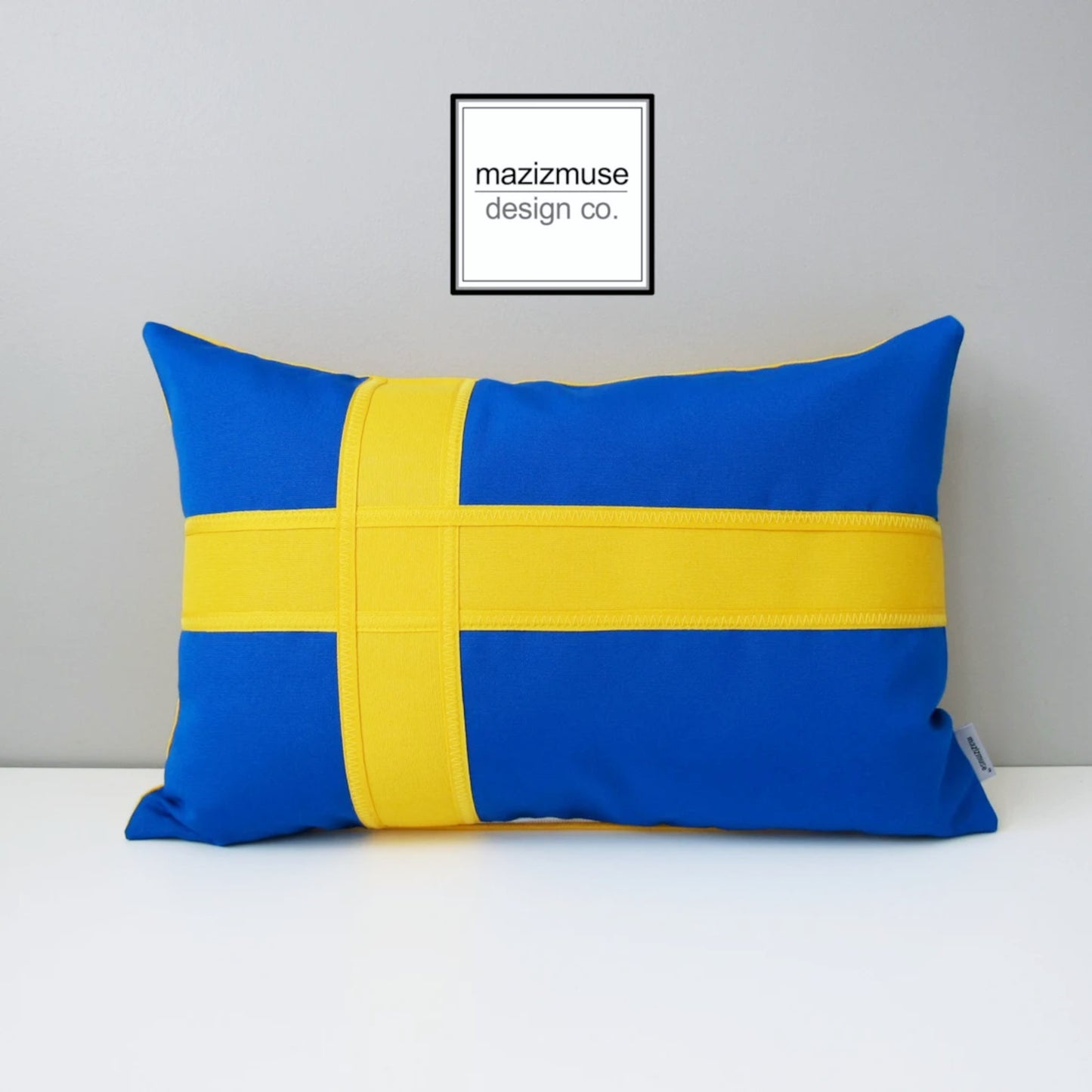 blue and yellow swedish flag pillow in sunbella fabric for outdoor and active indoor spaces