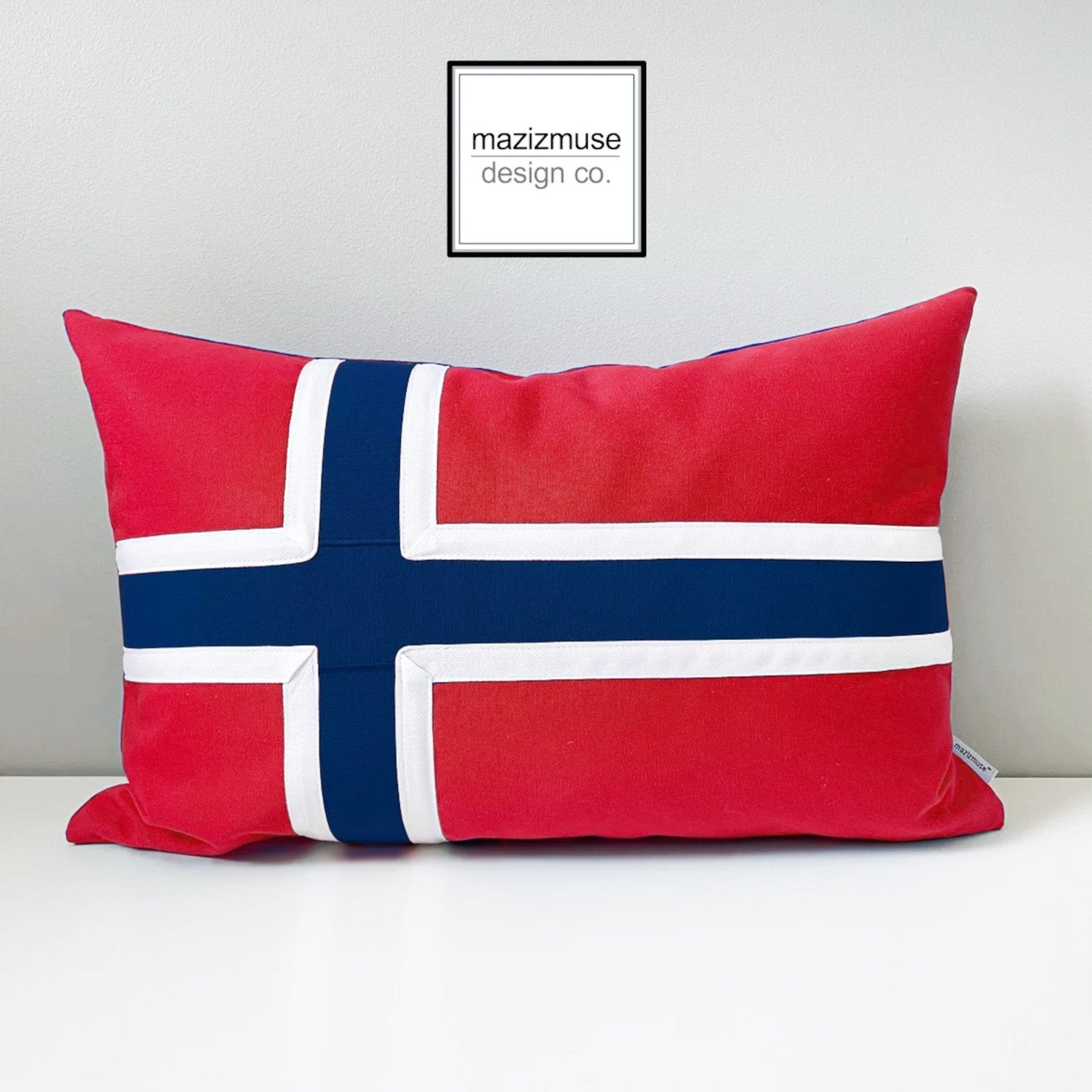 norweigian flag pillow in sunbrella indoor outdoor fabric for weather resistance. handmade in canada