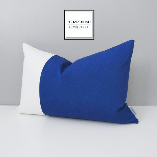 true blue and white sunbrella pillow in a colorblock design