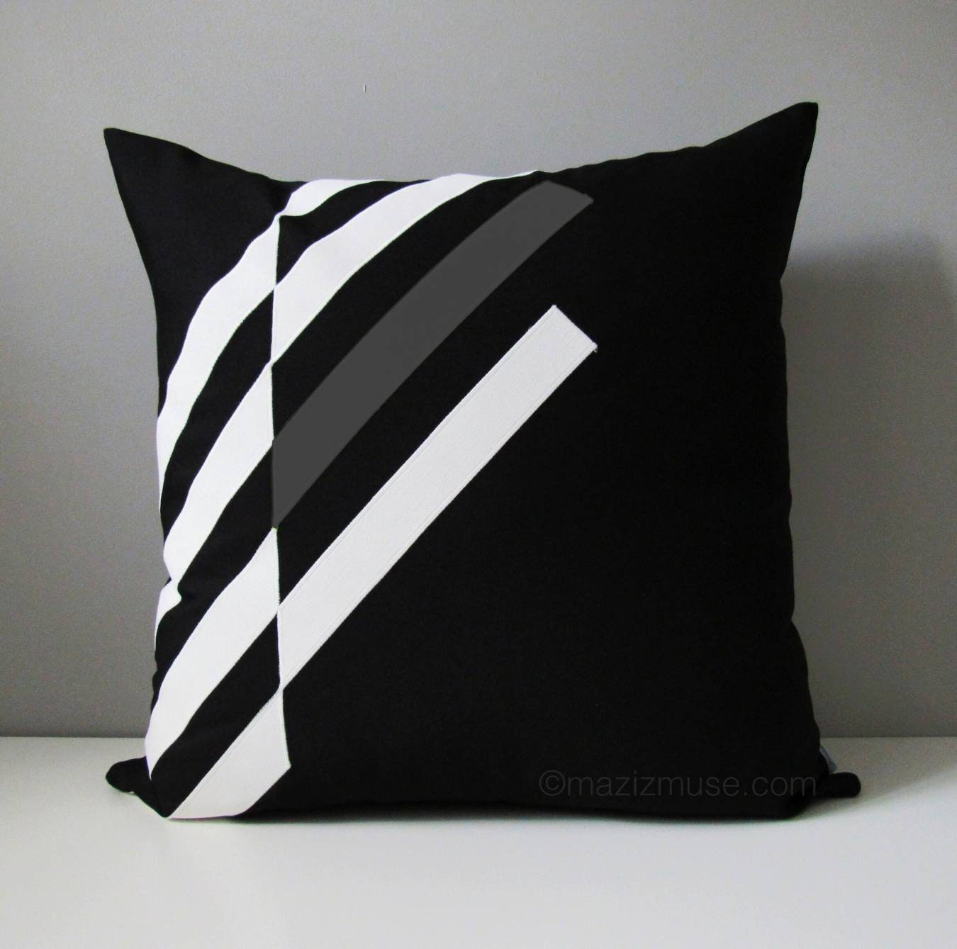 black white and grey geometric outdoor pillow in sunbrella fabric