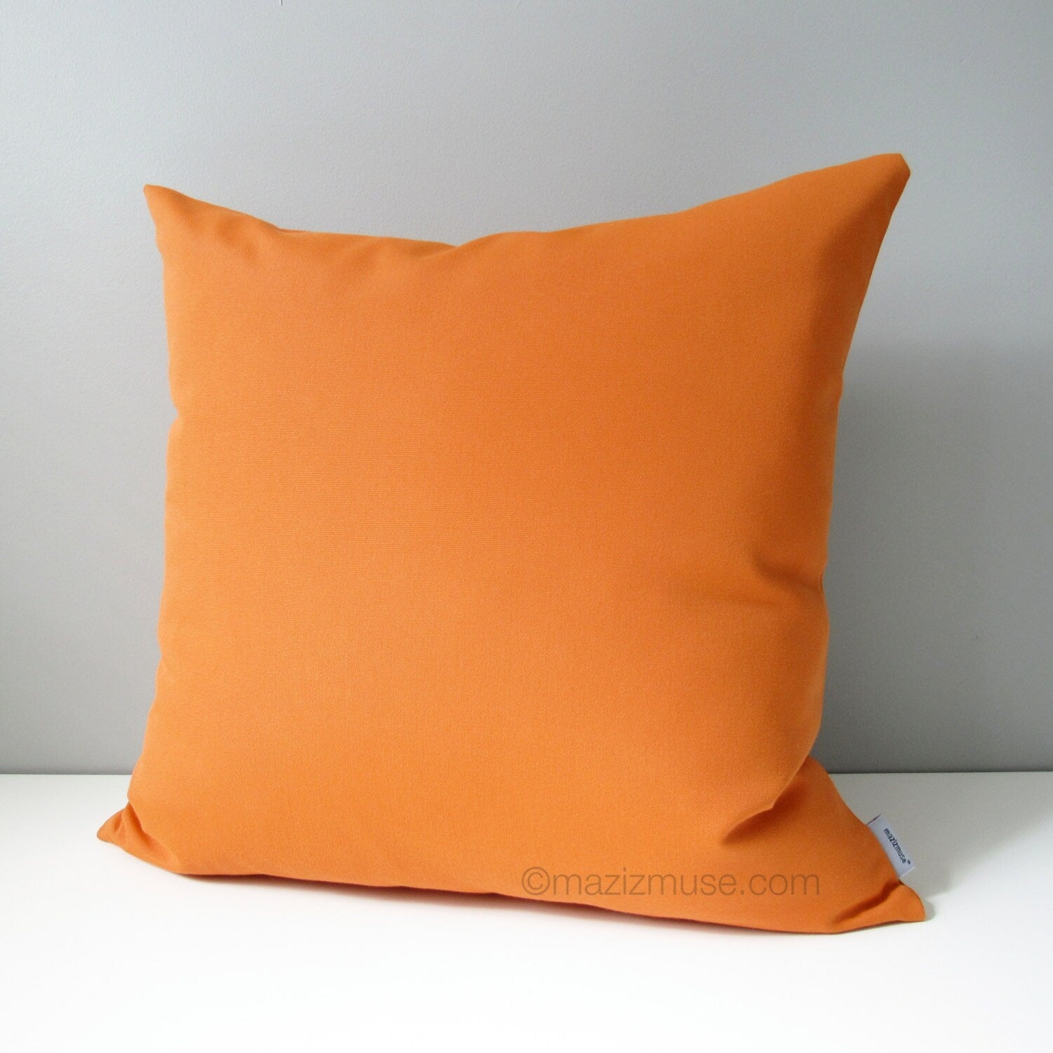 solid tuscan orange sunbrella outdoor pillow